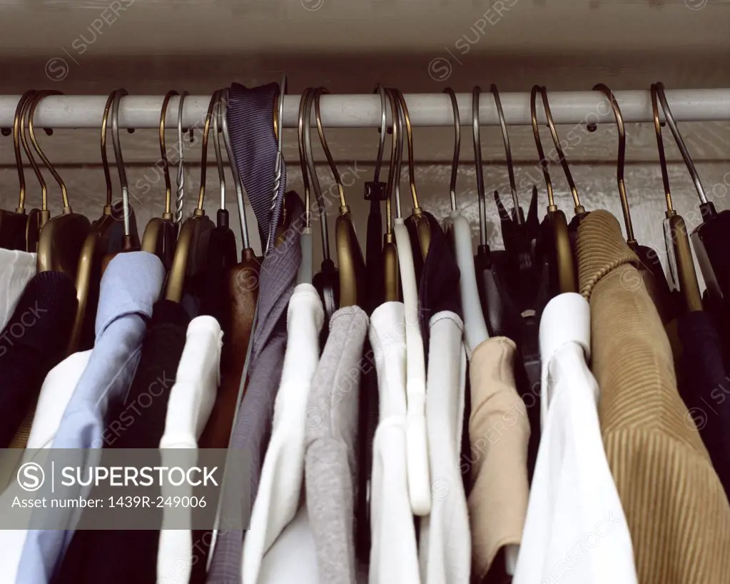 Clothes hanging in cupboard