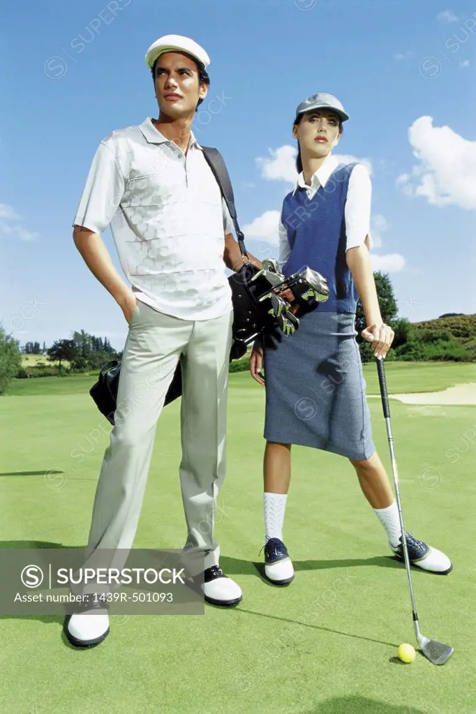 Man and woman playing golf
