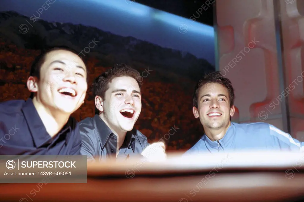 Men laughing in nightclub