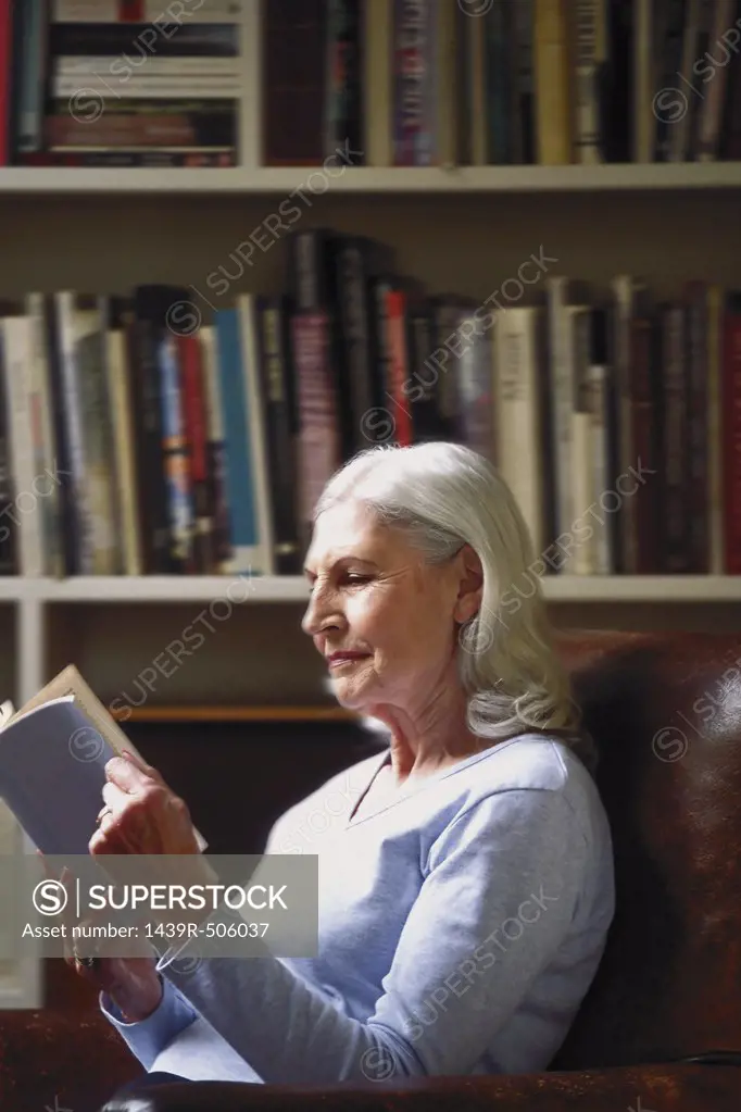 Woman reading in study