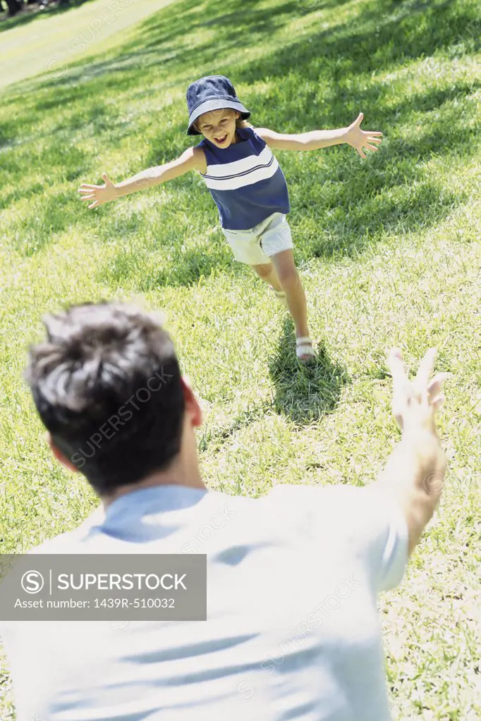 Girl running to her father