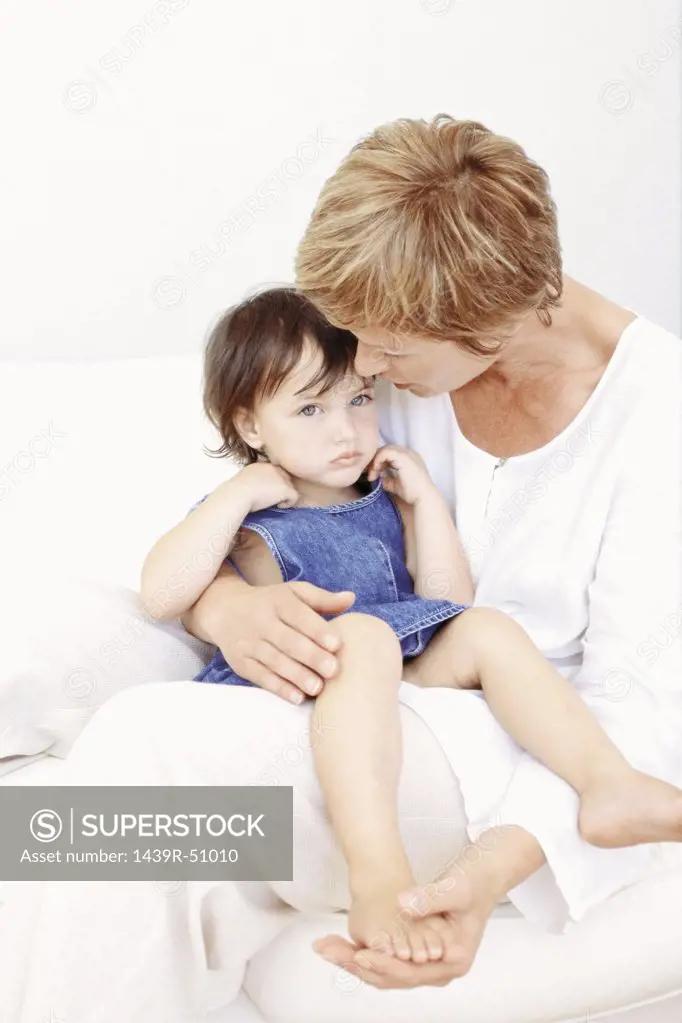 Grandmother comforting granddaughter