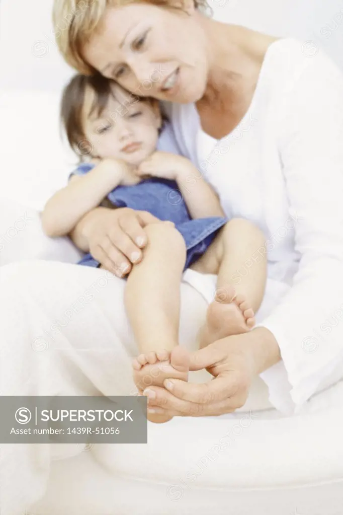 Grandmother with granddaughter on her lap
