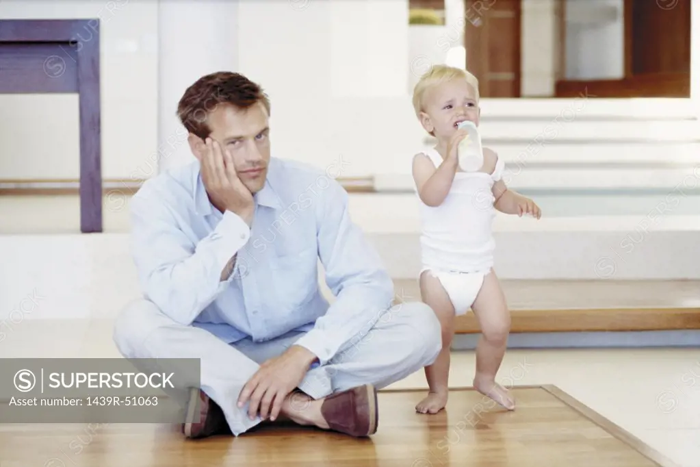 Tired father with crying toddler