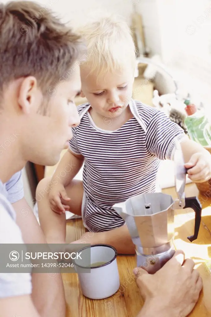 Father and child having breakfast 