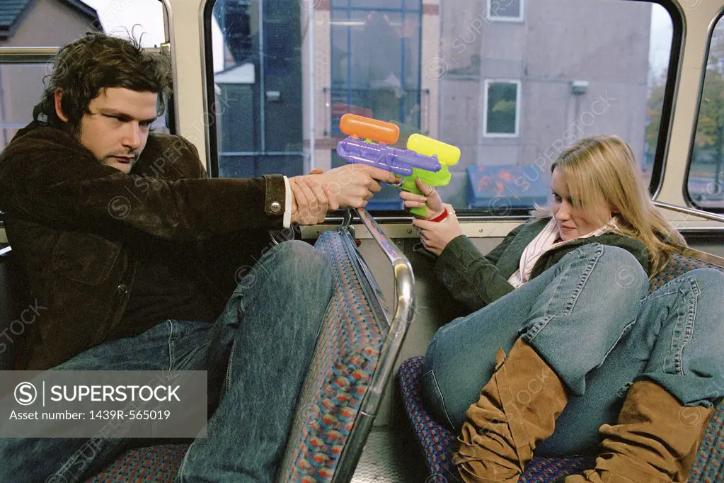 Couple with water pistols