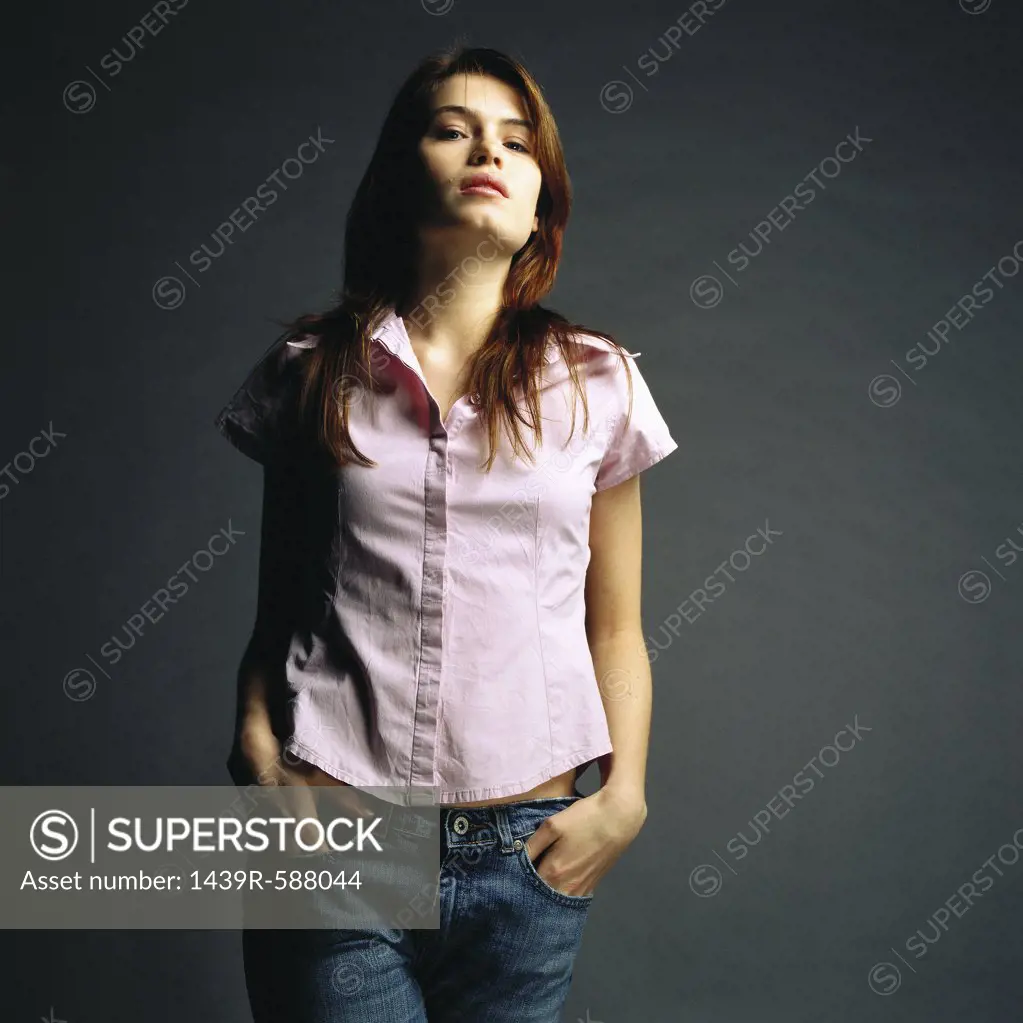 Woman with hands in pockets