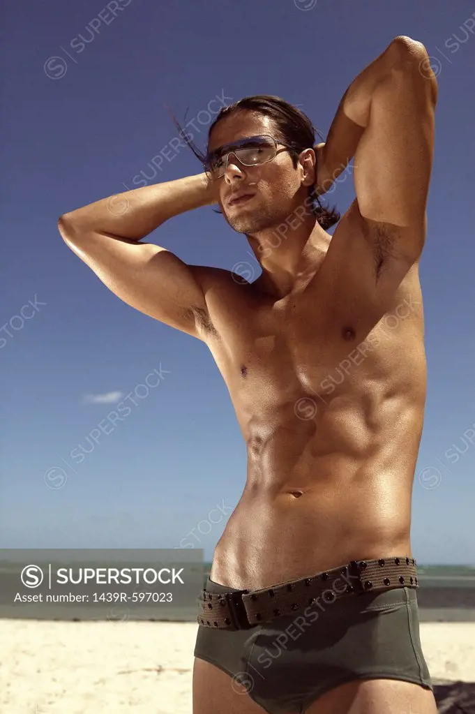 Man posing on beach
