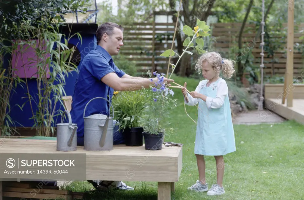 Father and daughter in garden