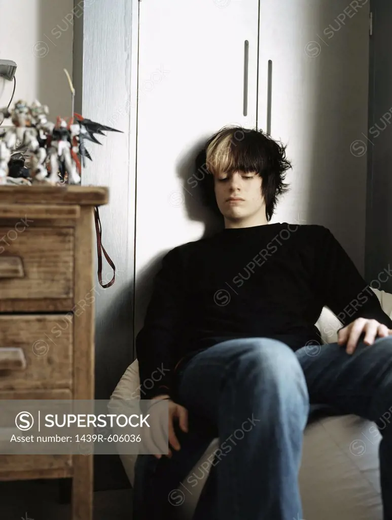 Teenage boy sitting on a beanbag
