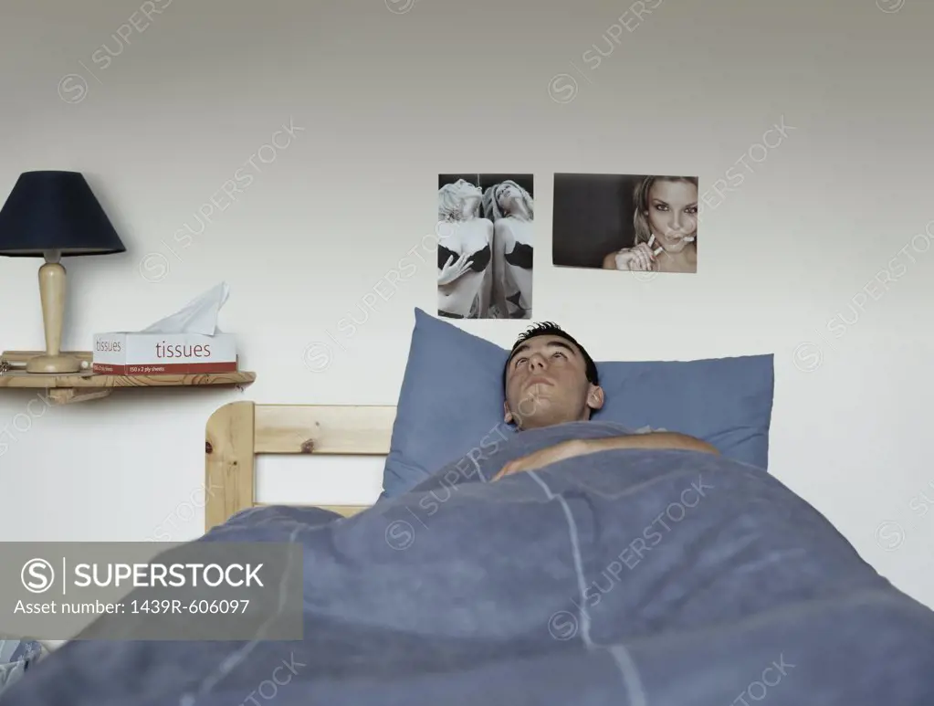 Teenage boy in bed