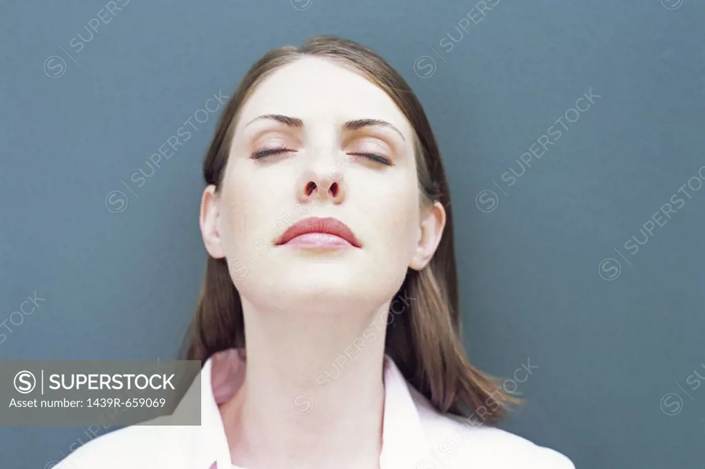 Woman with her eyes closed