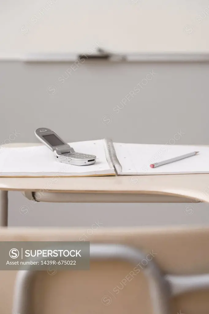 Mobile phone on a classroom desk