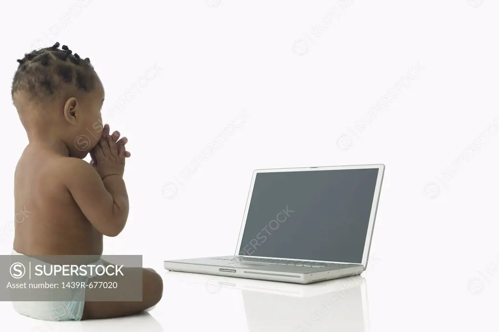 Baby with laptop computer