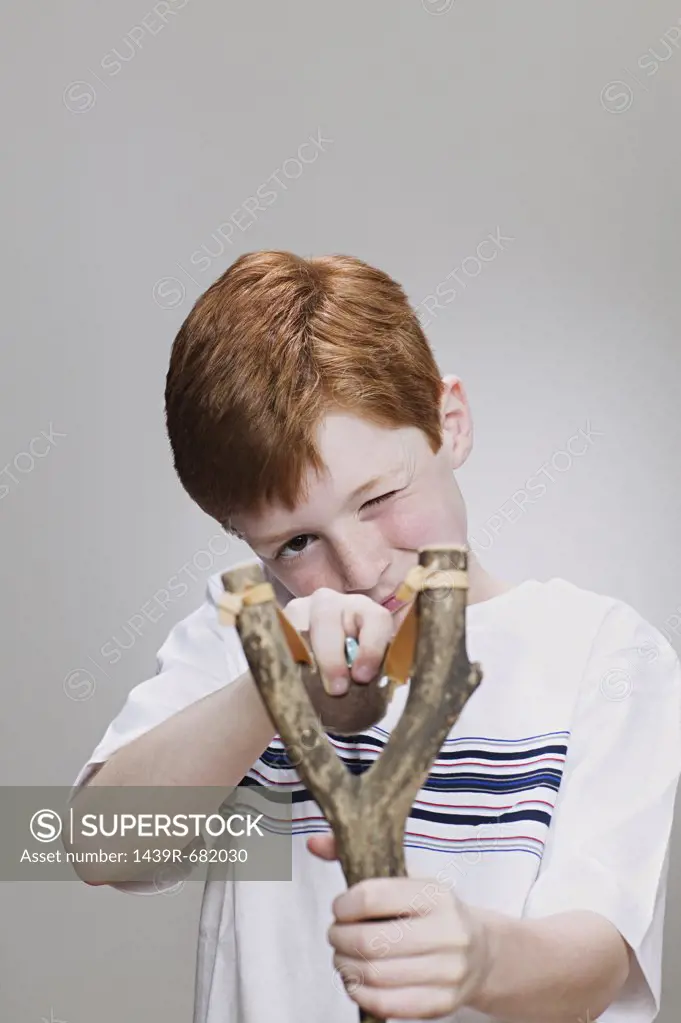 Boy using a catapult