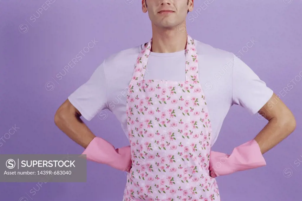Man in an apron and rubber gloves 