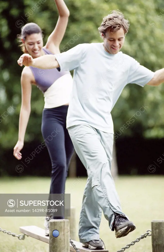 Couple on obstacle course
