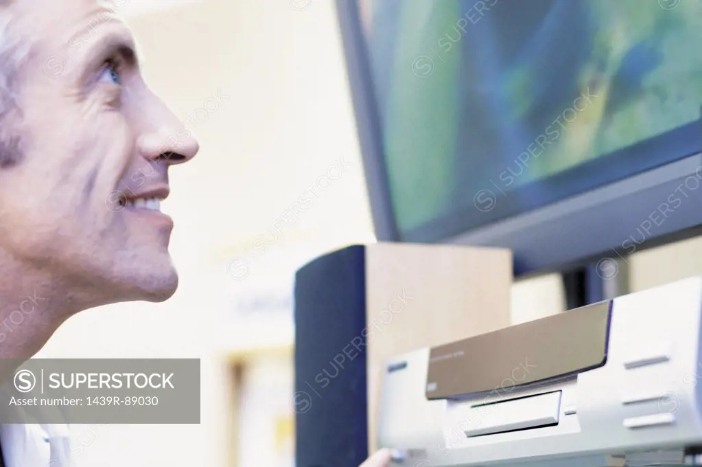 Man looking at television