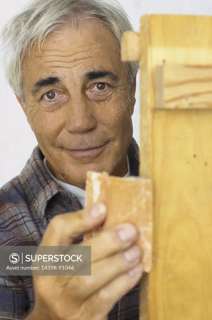 Man sanding wood