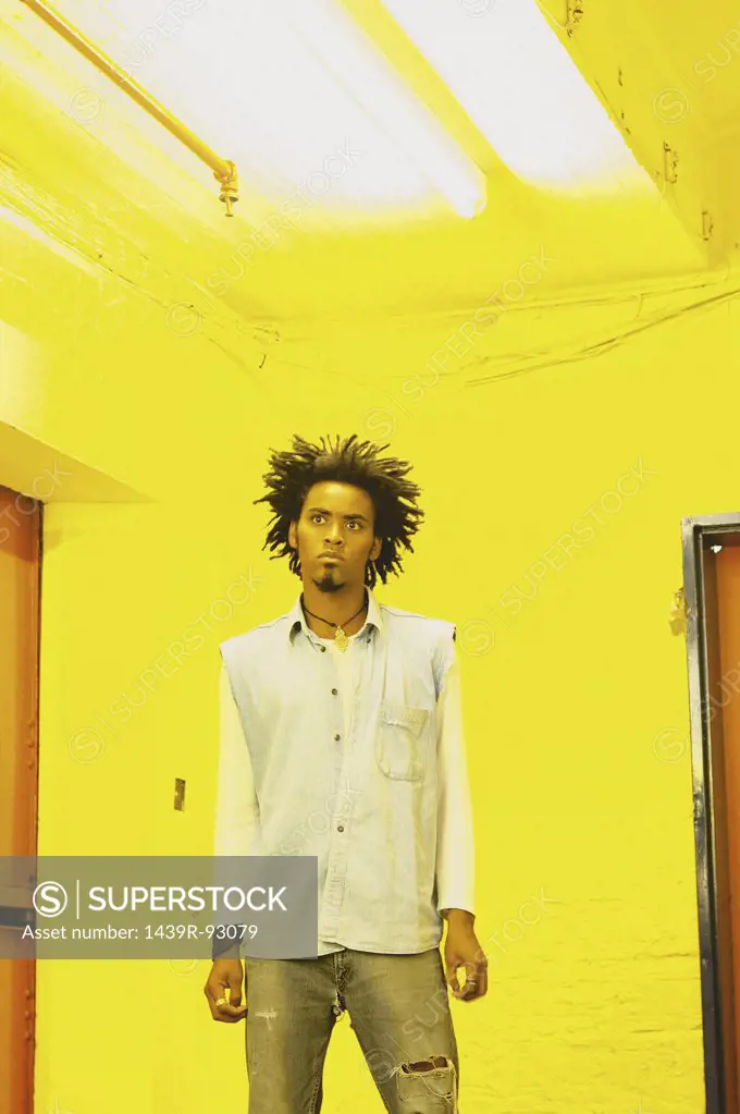 Man standing in yellow room