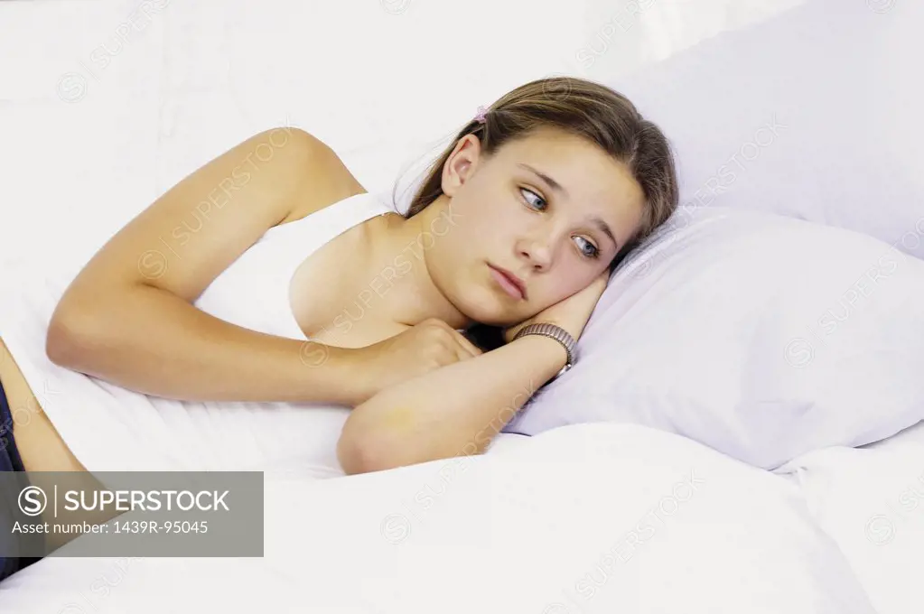 Teenage girl on bed