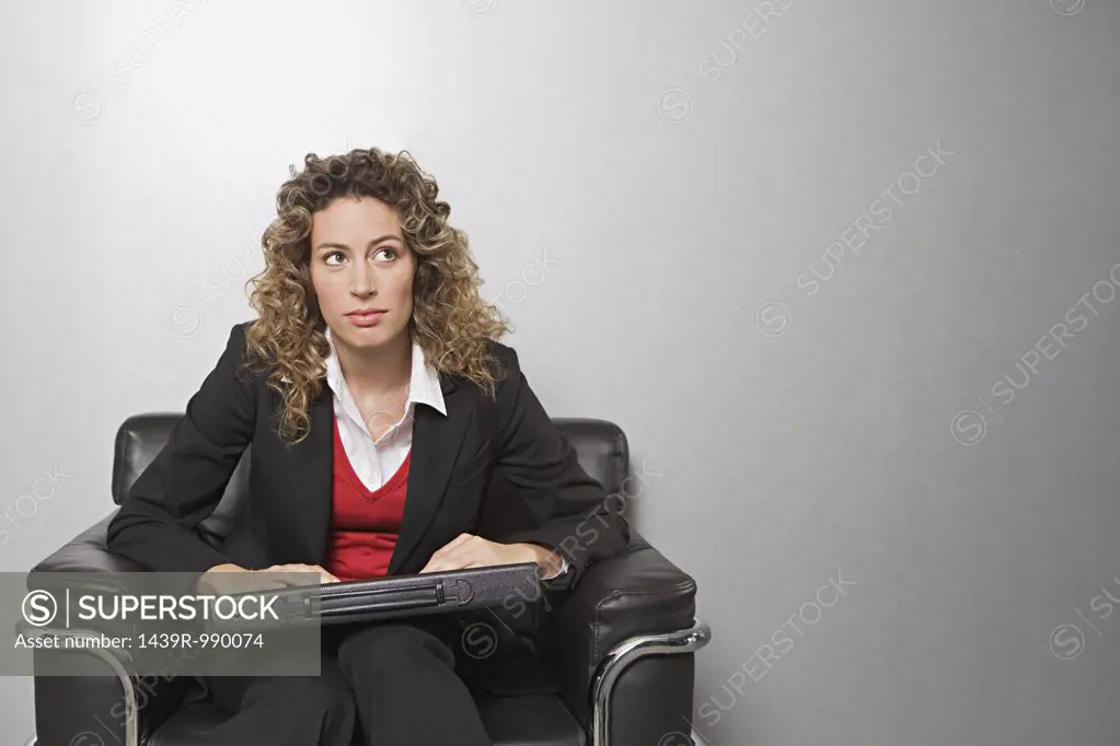Businesswoman in an armchair