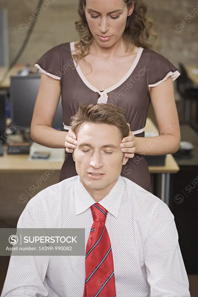 Woman massaging her colleague