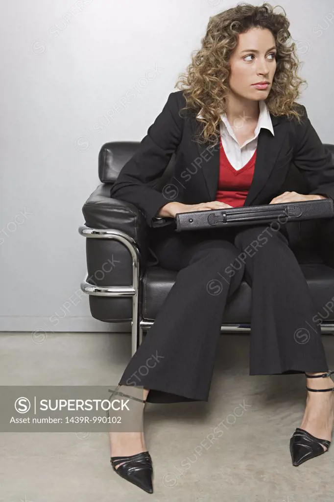 Businesswoman in an arm chair