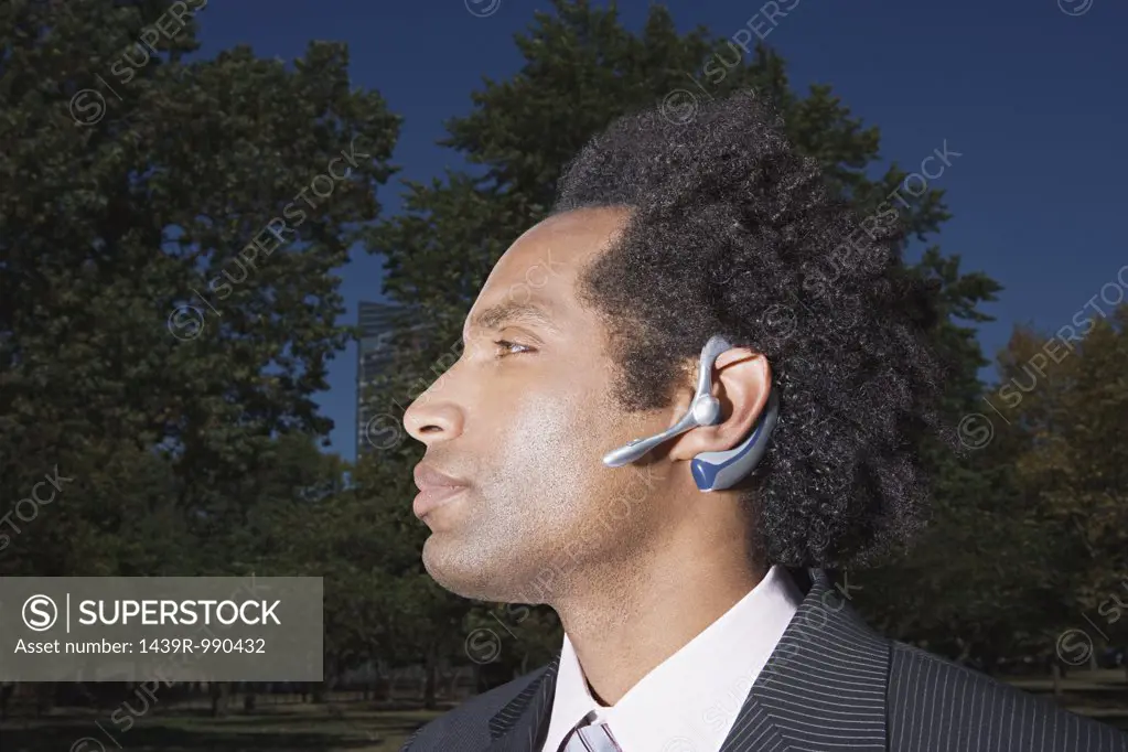 Businessman wearing a bluetooth headset