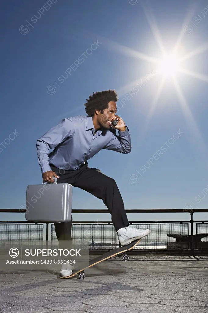 Businessman on a skateboard