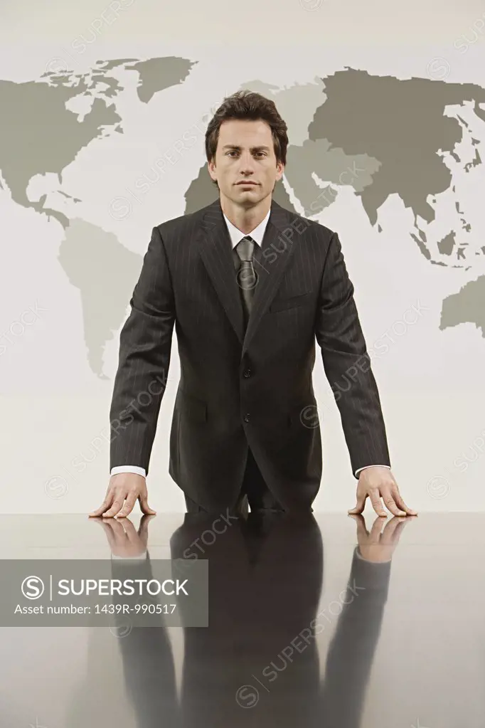 Businessman in front a map of the world 