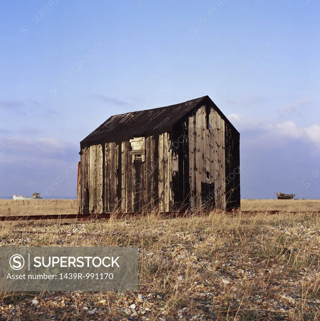 Dilapidated shed on a plain