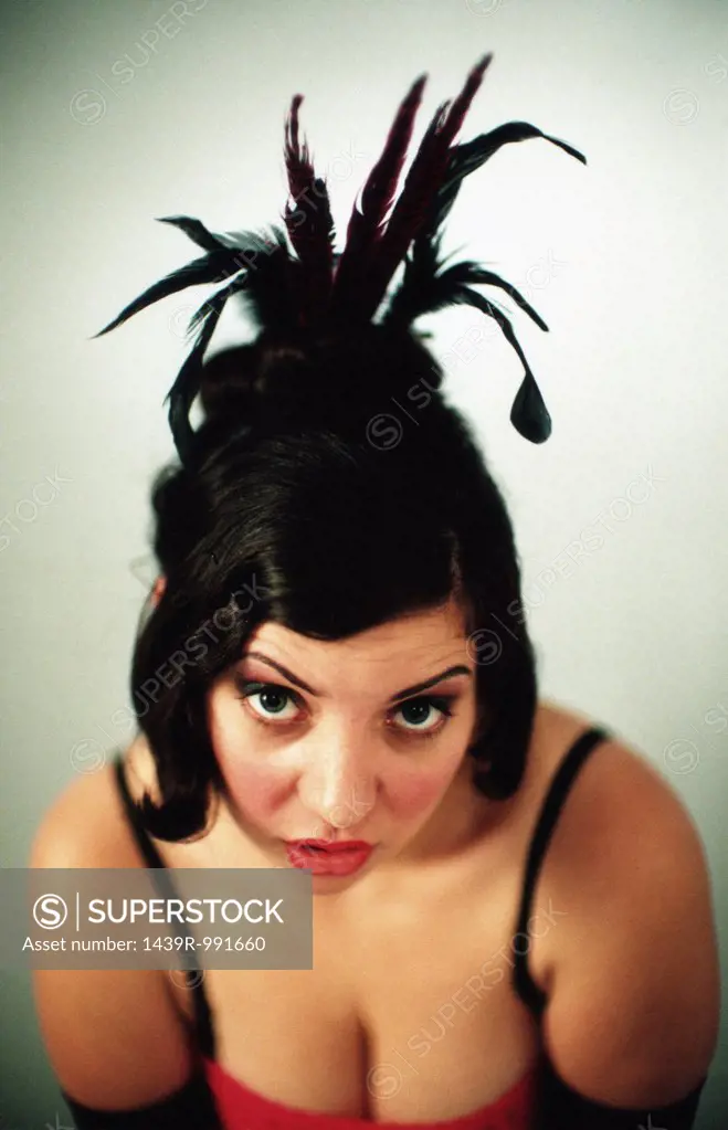 Young woman wearing a feather headdress