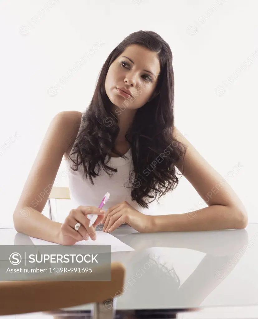 Young woman writing a letter