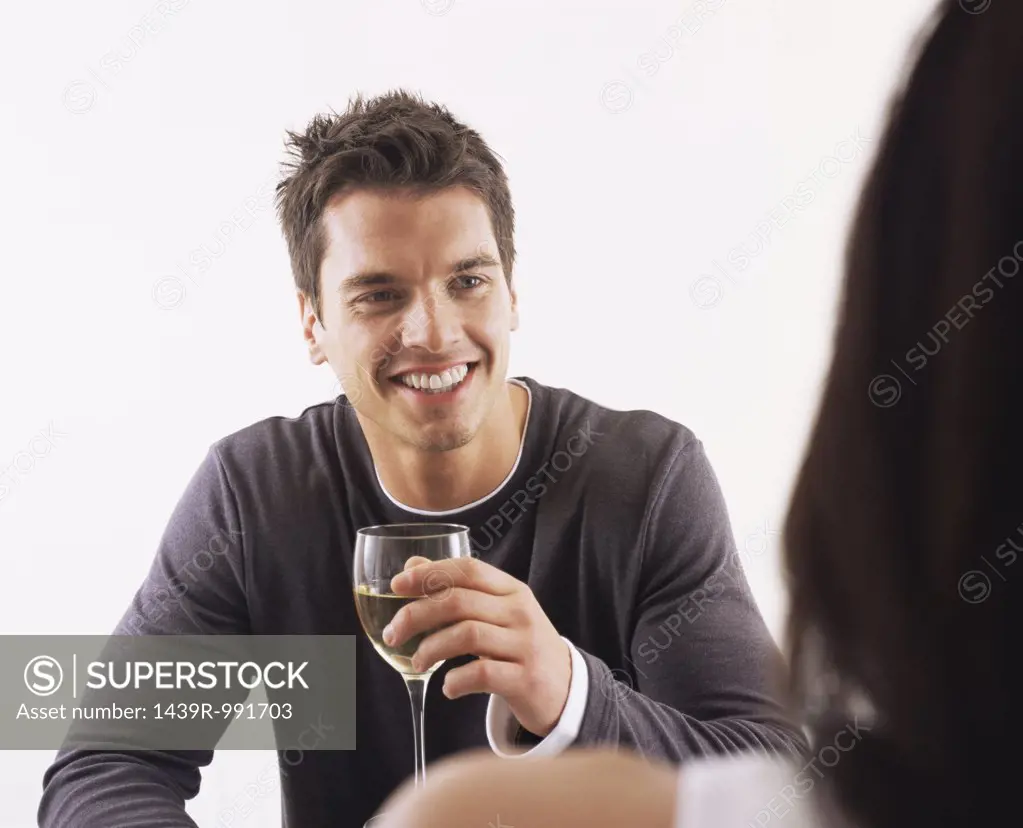 Man and woman having wine