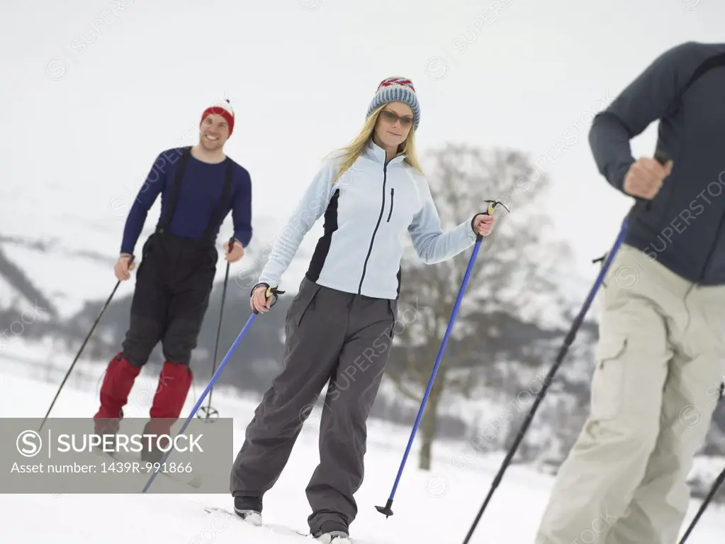 Friends walking on skis