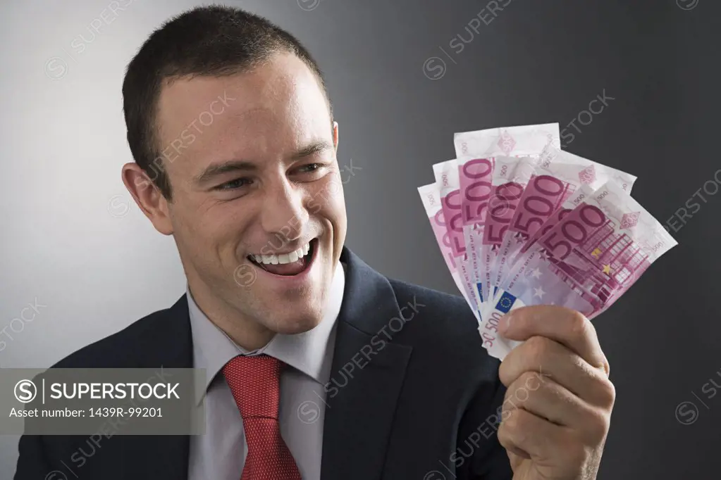 Businessman holding bank notes