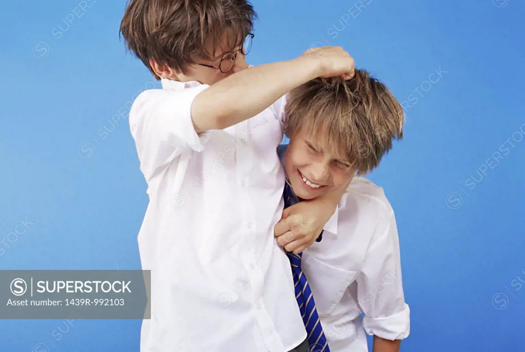 Schoolboys playfighting