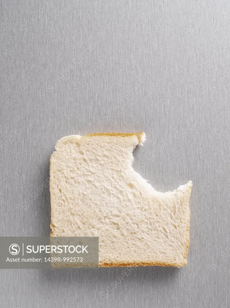 Missing bite from a slice of bread