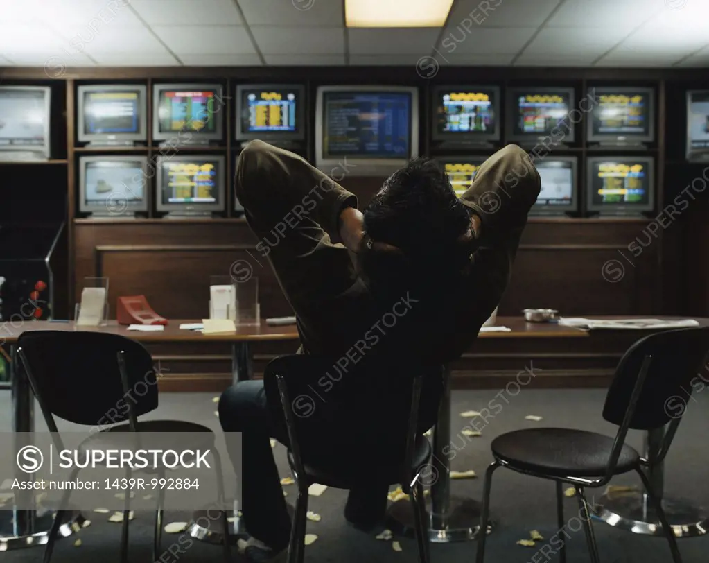 Man sitting in a betting shop