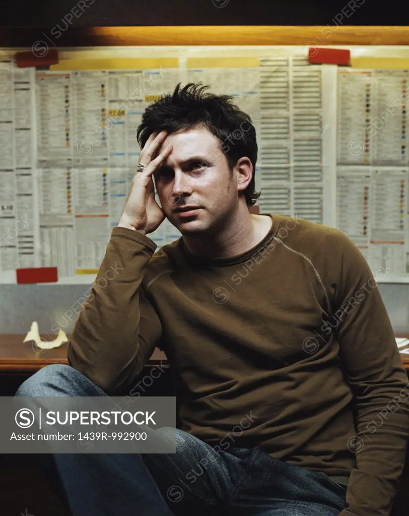 Stressed man in a betting shop