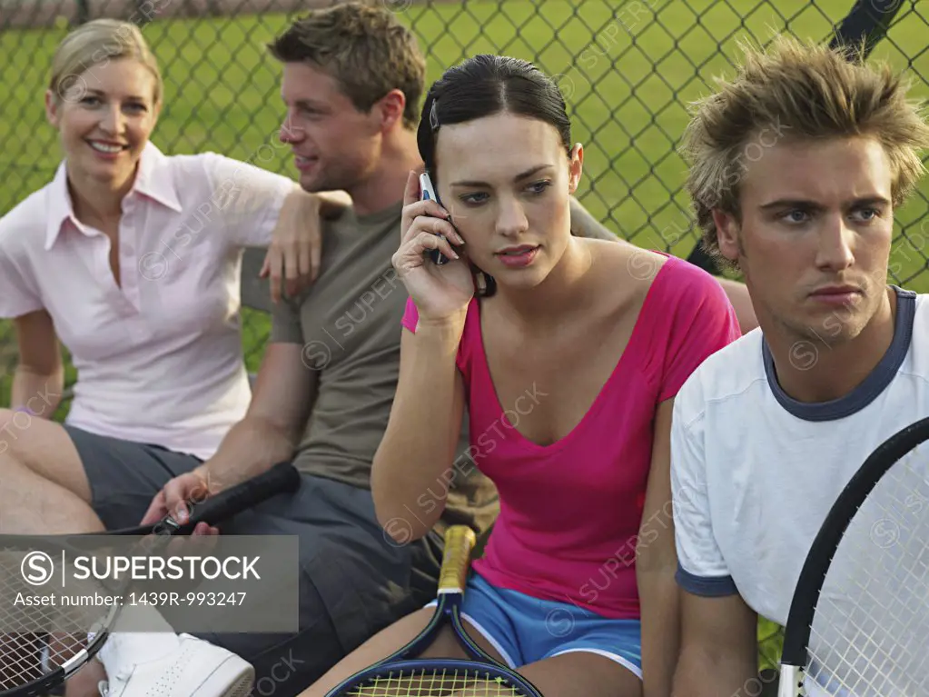 Young people at tennis court