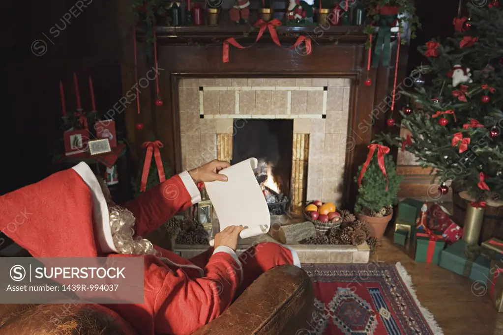 Santa claus reading a note