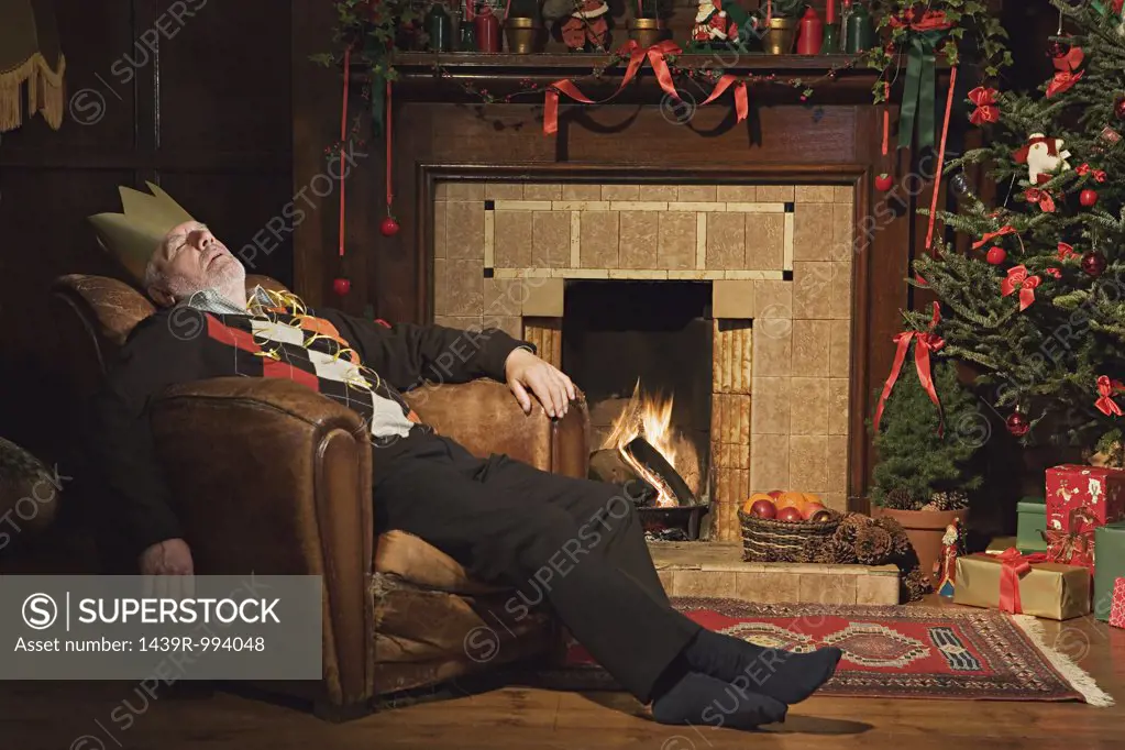 Man sleeping by fireplace