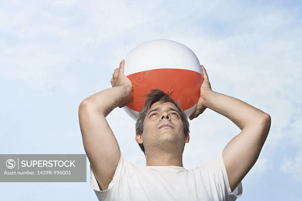 Man holding beachball