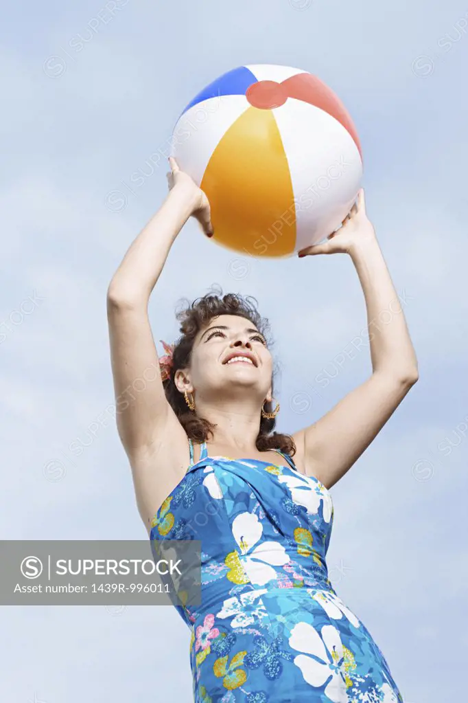 Woman holding a beachball