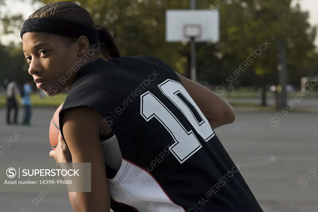 Woman playing basketball