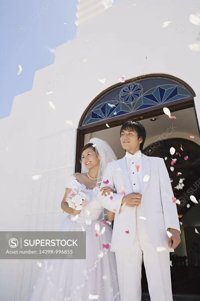 Confetti showering upon newlyweds