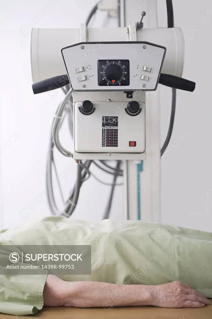 Patient under a machine