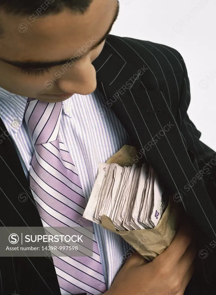 Businessman with wad of cash
